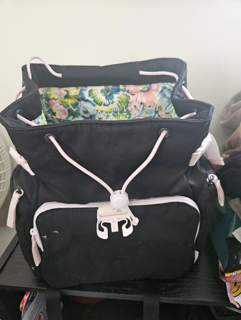 Black Drawstring Backpack with Pink Trim and Floral Lining